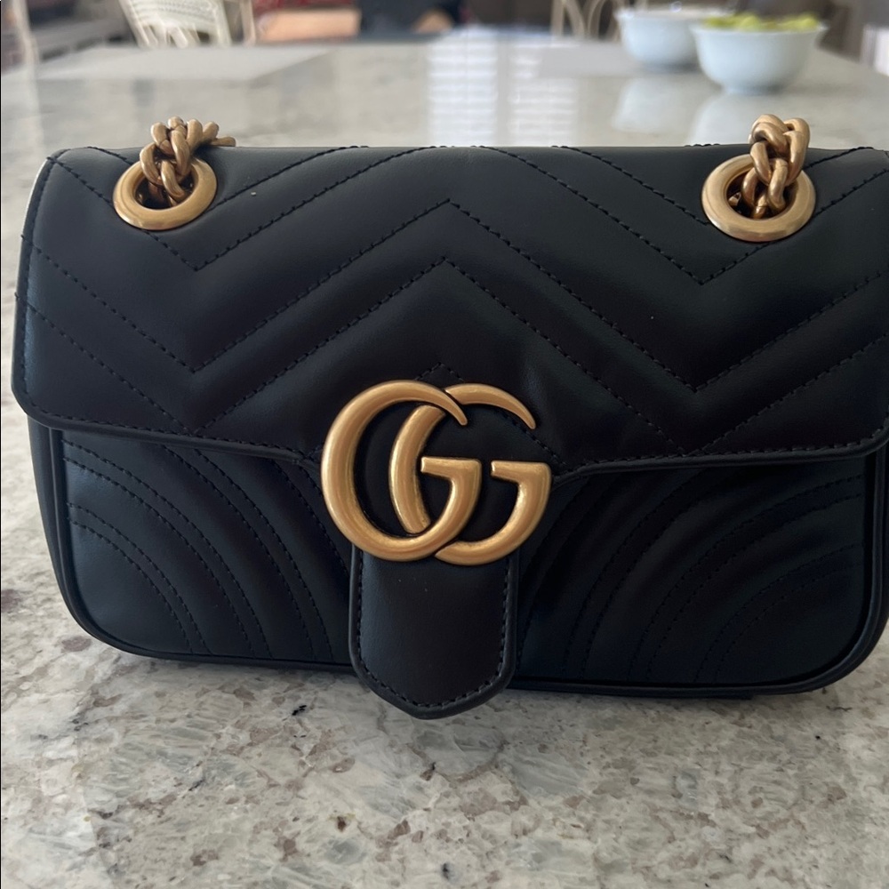 Gucci Marmont black shoulder bag.100% authentic,new with proof of purchase.